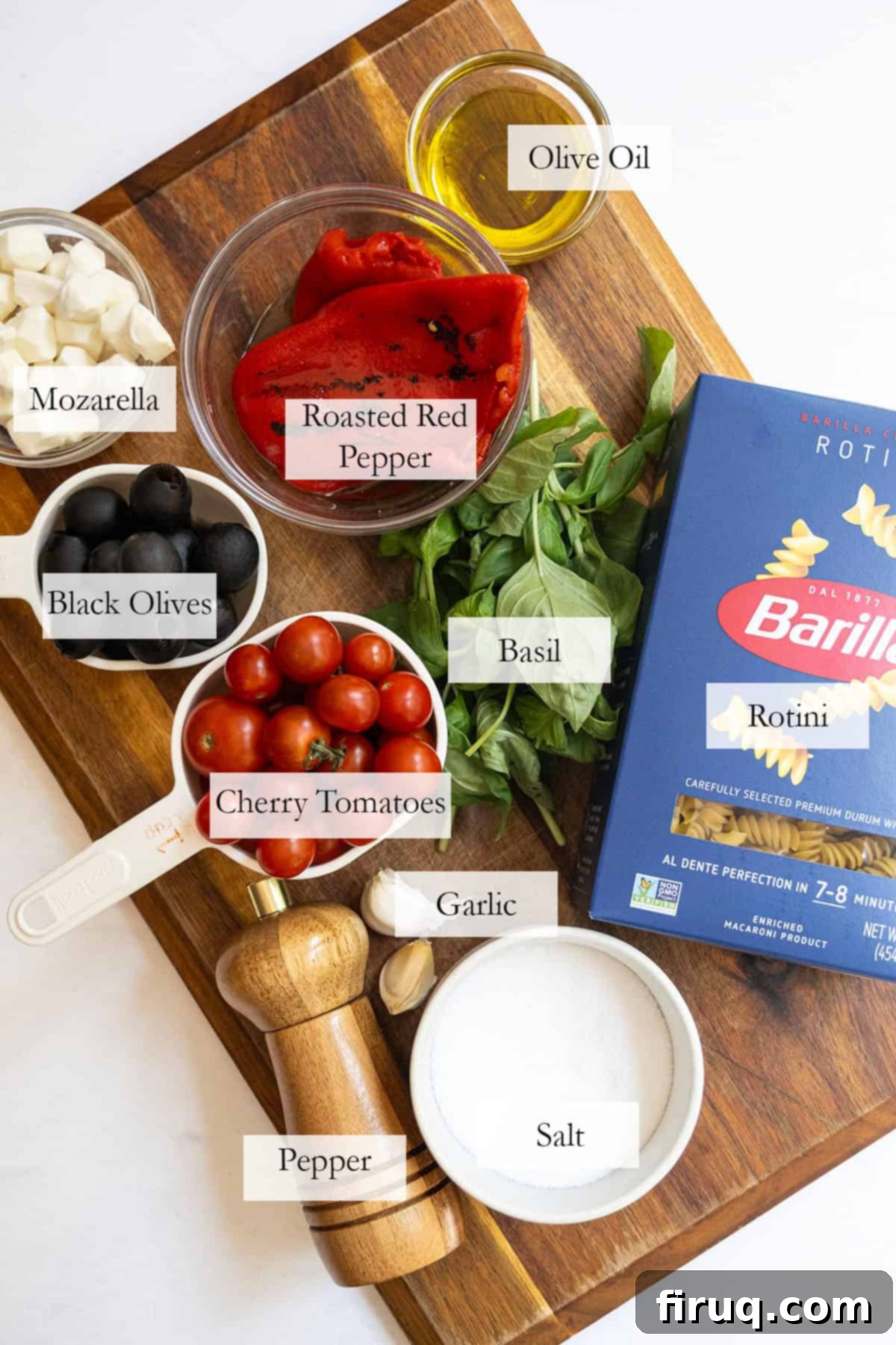 Zesty Italian Pasta Salad 3 ingredients for the pasta salad on a cutting board.