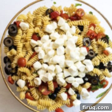 Zesty Italian Pasta Salad 7 mozzarella balls on top of the pasta salad.