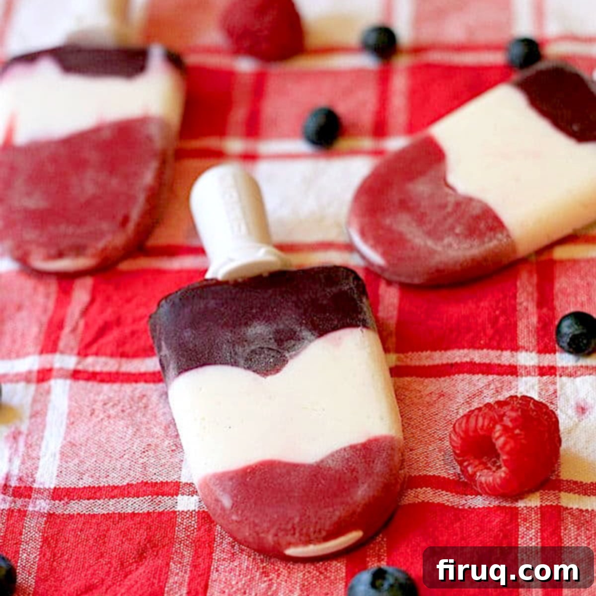 Red White and Blue Berry Popsicles Red, White, and Blue Berry Popsicles with raspberries, blueberries and Greek yogurt