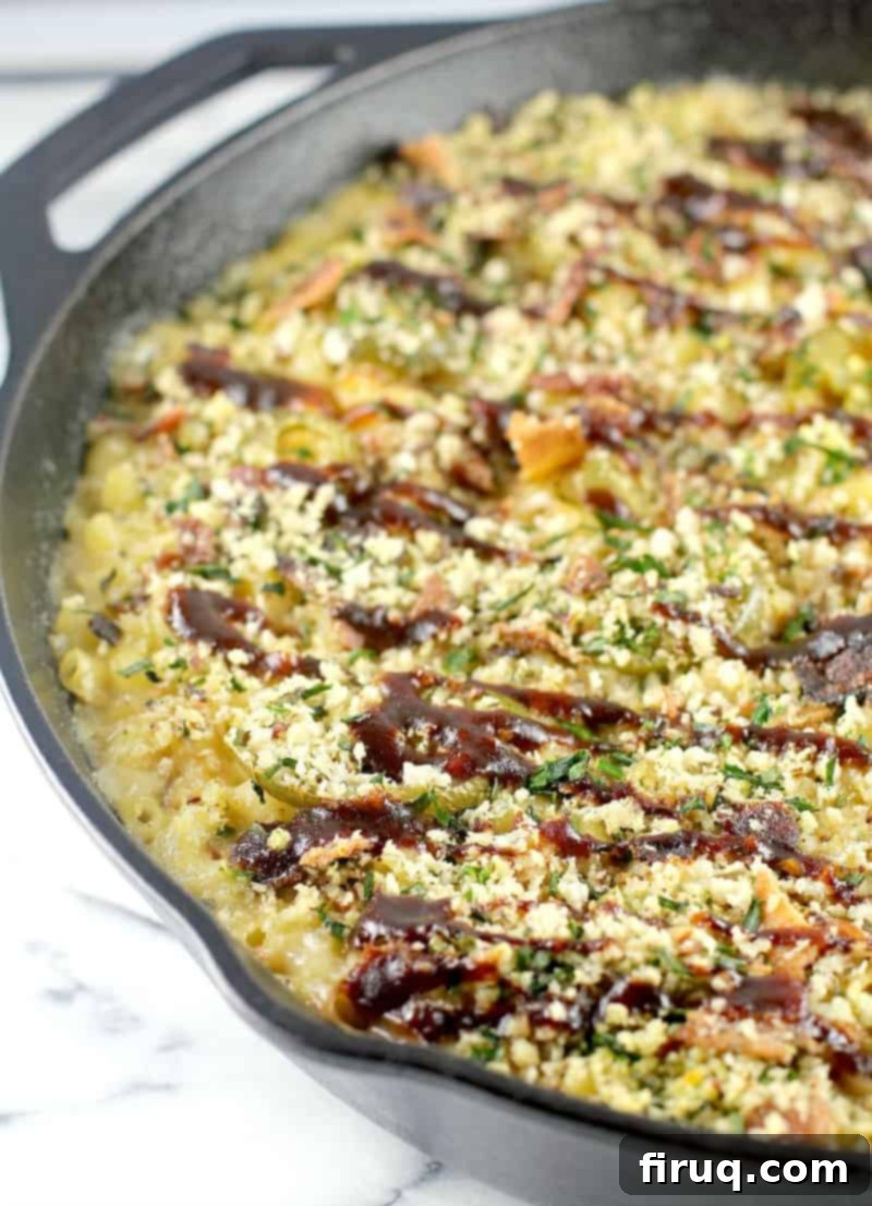 Hearty Pulled Pork Macaroni and Cheese Topped with Crispy Bacon and Fresh Herbs 3 Overhead shot of a baking dish filled with Pulled Pork Macaroni and Cheese, ready to be served
