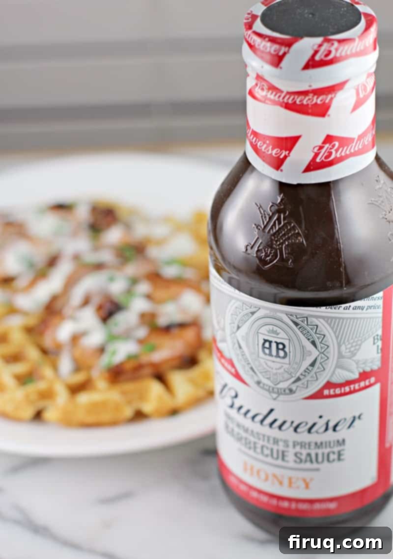 Honeyed Ale BBQ Chicken Waffle Stack 3 Close-up of freshly grilled Honey Beer BBQ Chicken on a wooden cutting board, sliced and ready to serve.