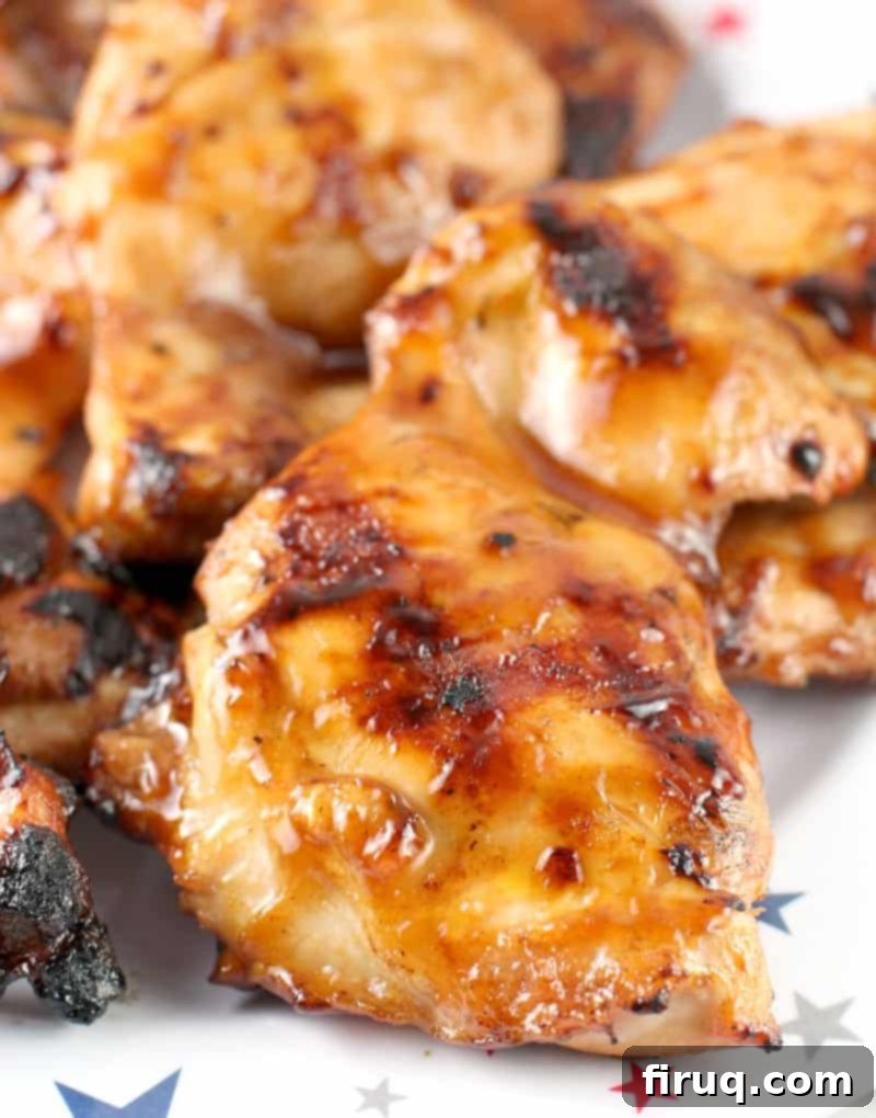 Honeyed Ale BBQ Chicken Waffle Stack 4 Honey Beer BBQ Chicken thighs sizzling on a hot grill, coated in rich barbecue sauce.