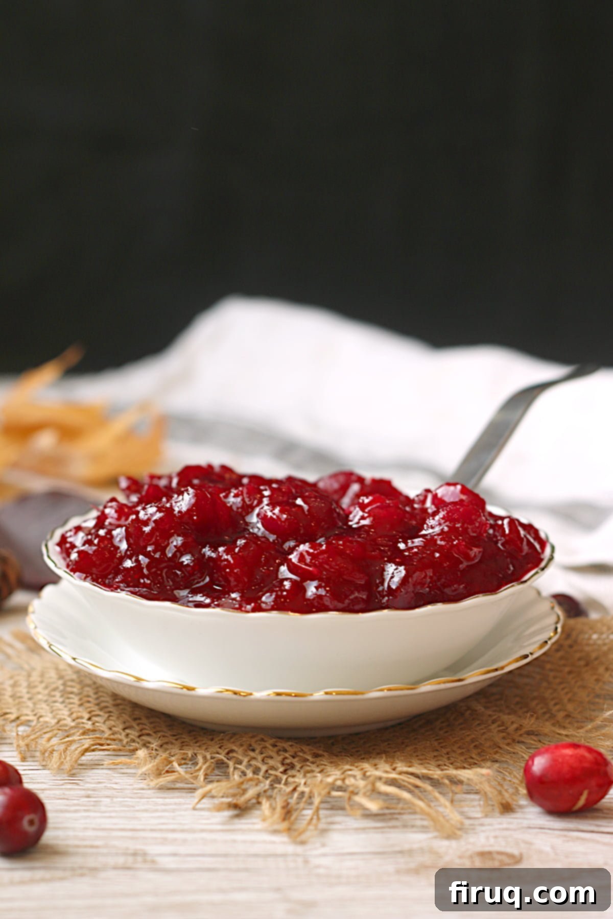 Freshly Cooked Cranberry Sauce Cooling Close-up of Easy Homemade Cranberry Sauce with orange zest visible.