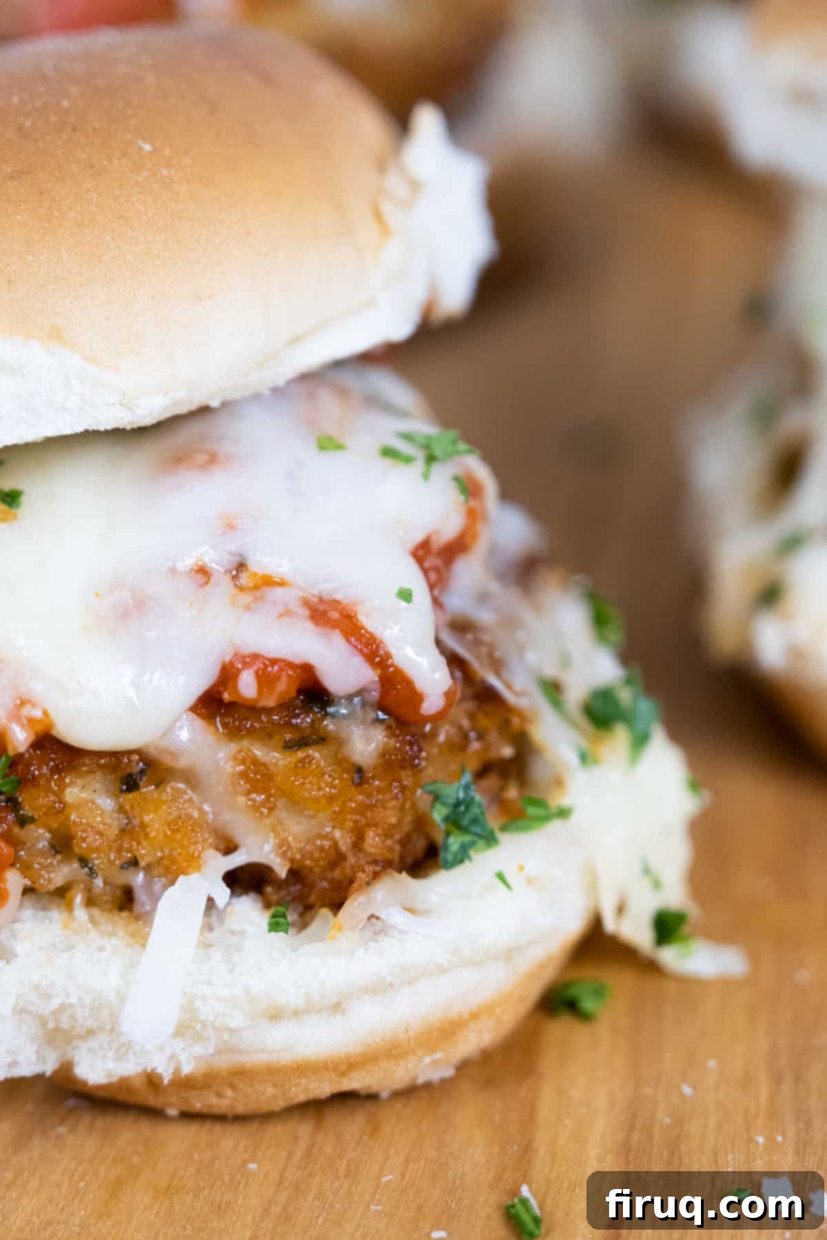 Mouthwatering Chicken Parm Minis 3 chicken parm slider with tomato sauce and melted mozzarella