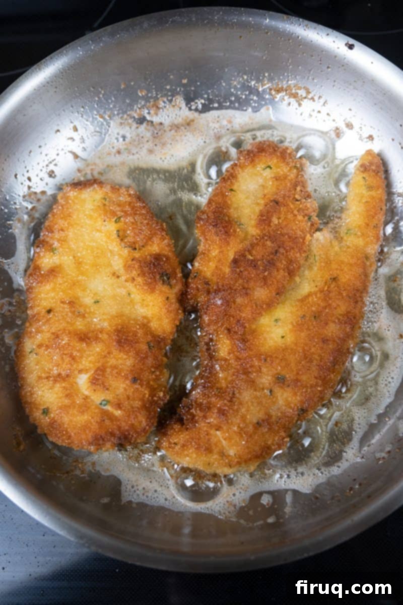 Best Oil for Crispy Chicken Cutlets 8 chicken cutlets frying in canola oil