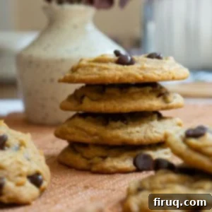Soft and Chewy Pumpkin Spice Chocolate Chip Cookies 12 A close-up stack of perfectly baked chewy pumpkin chocolate chip cookies from the recipe card, highlighting their soft texture.