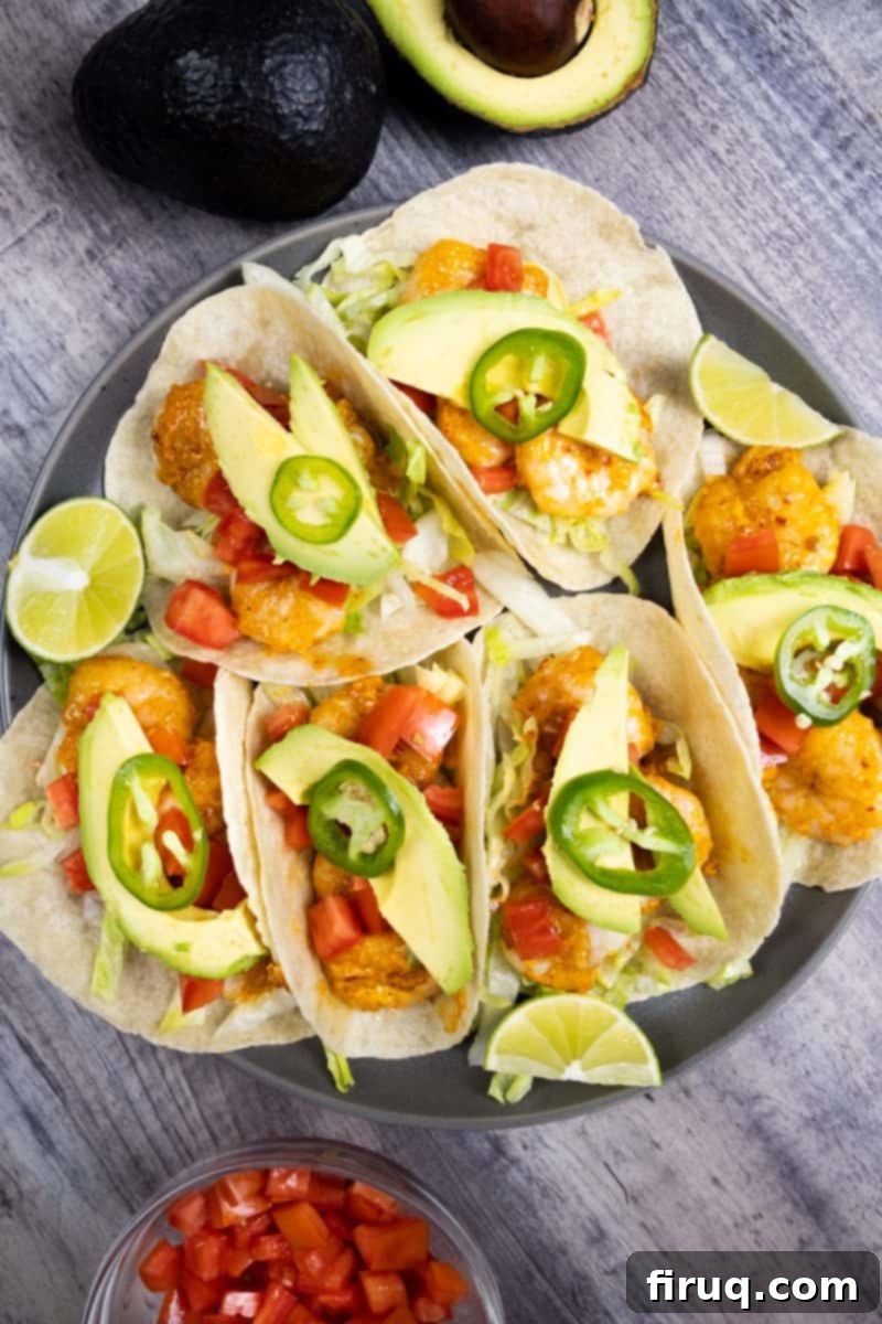 Molten Shrimp Tacos 4 volcano shrimp tacos topped with tomato, avocado, and jalapeno