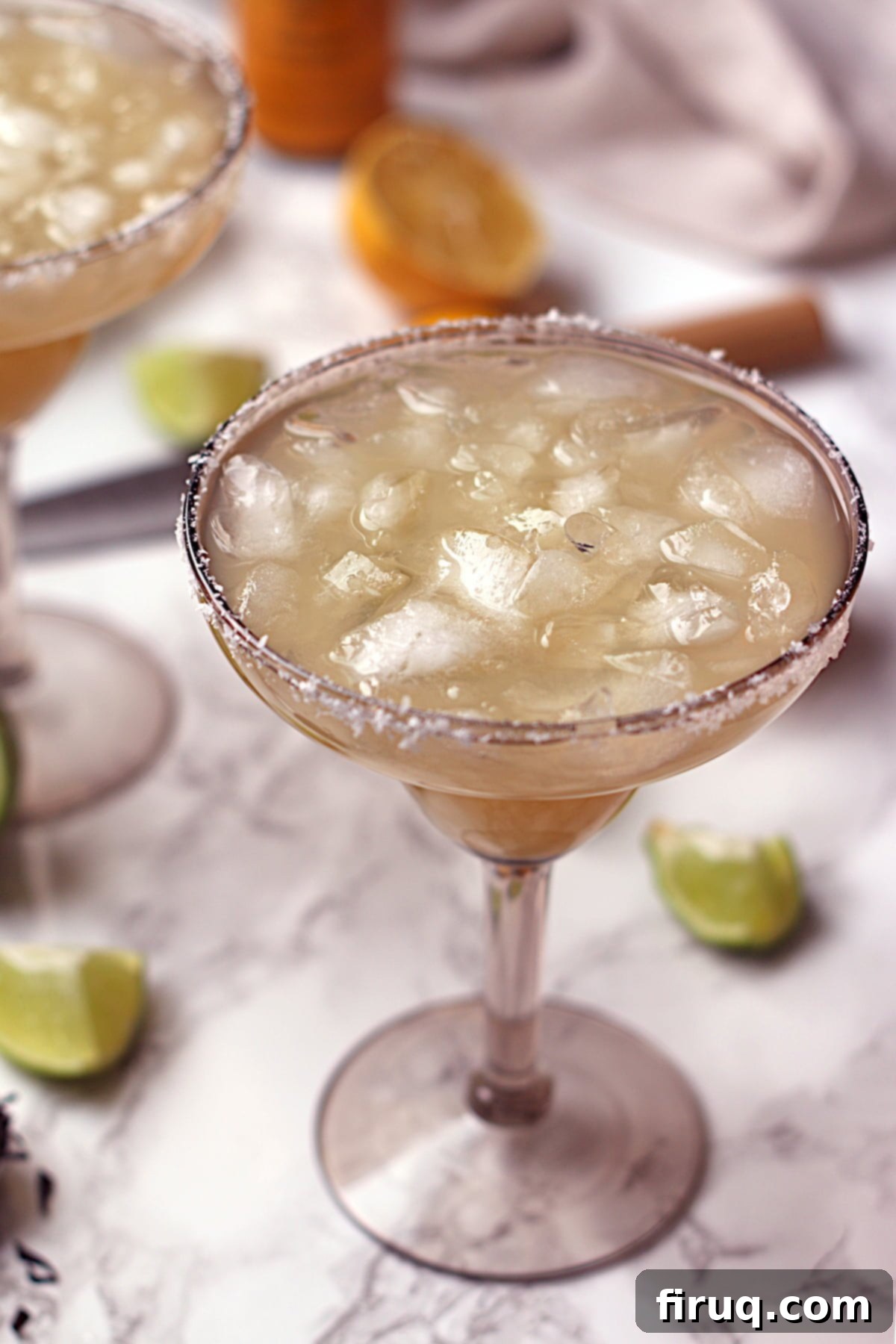 Single Smoky Mocktail Margarita A non-alcholic lime margarita over ice in a smoky grey margarita glass.