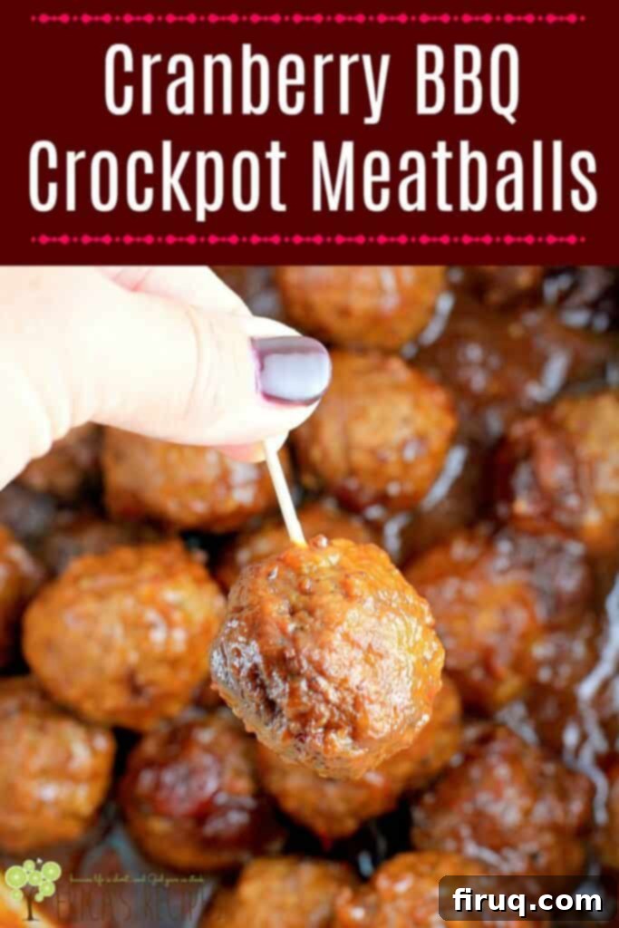 Slow Cooker Sweet Tangy Cranberry BBQ Meatballs 8 pin image of a hand lifting a meatball out of the crockpot on a toothpick
