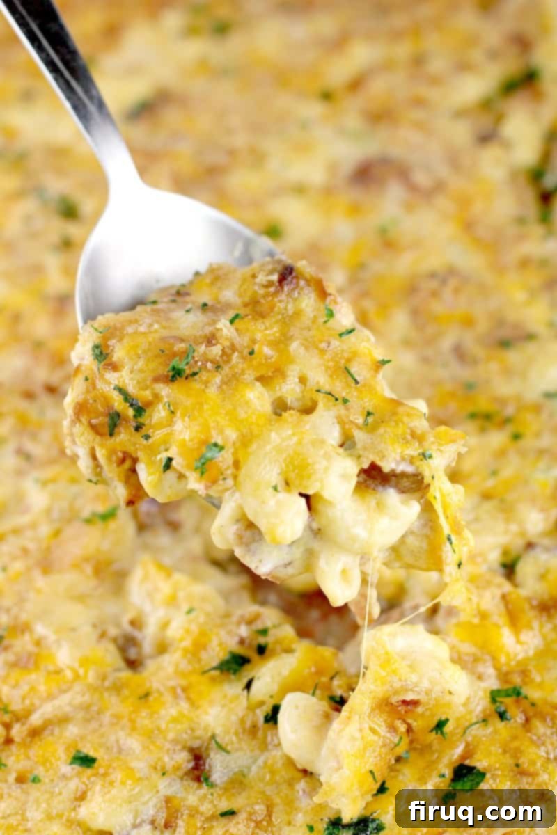 Bayou Mac and Cheese 3 spoon scooping up macaroni and cheese