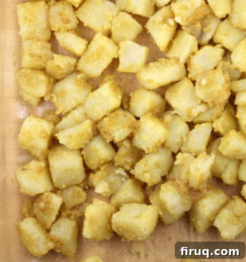 Zesty Cheesy Potato Bites 5 uncooked potatoes coated in seasoning before cooking