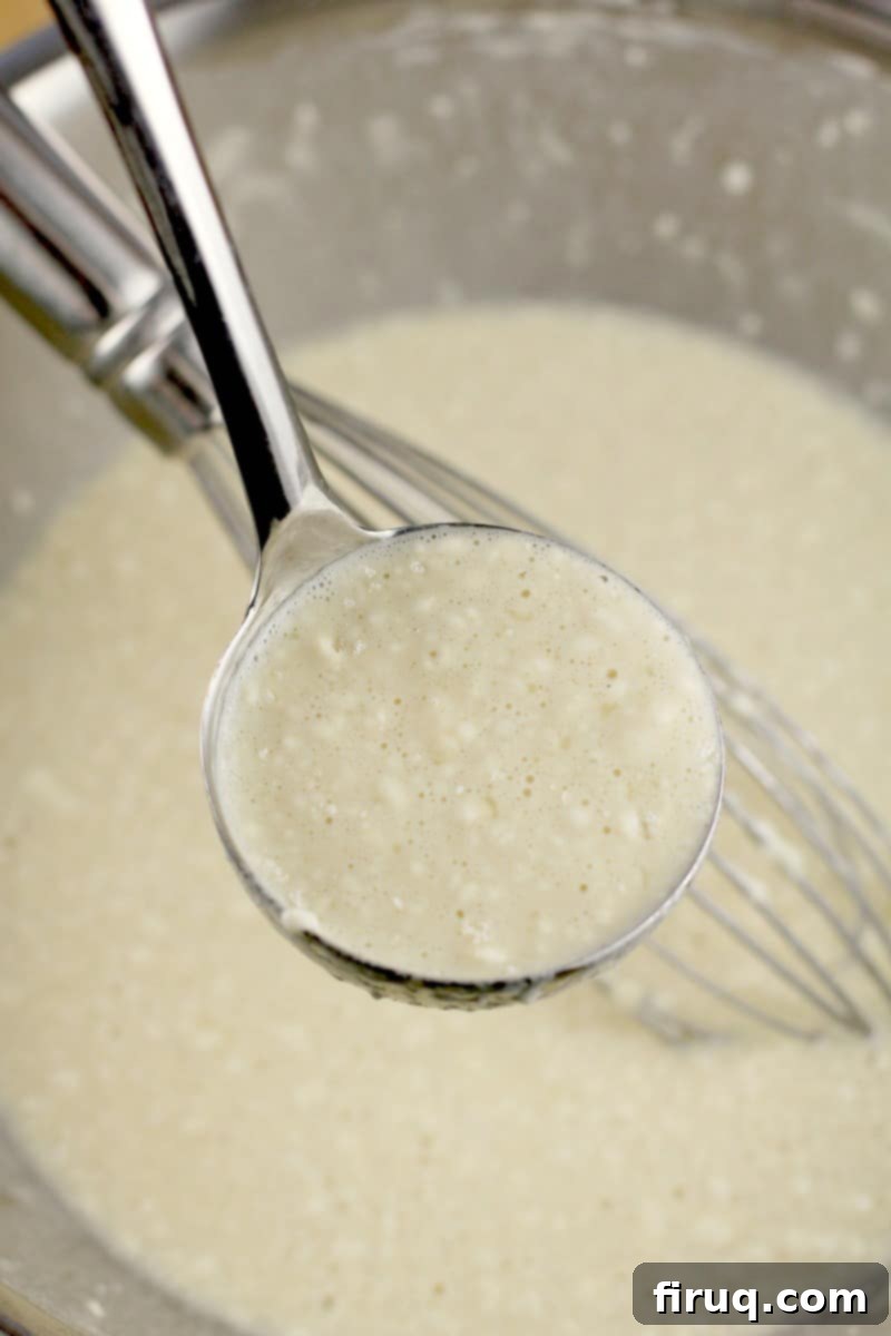 Easy Homemade Savory Crepes 4 ladle with crepe batter