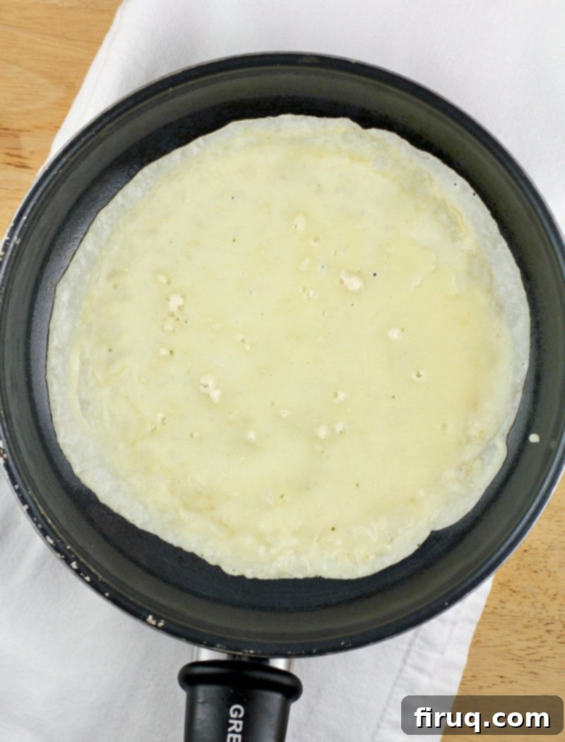 Easy Homemade Savory Crepes 5 crepe batter in a pan