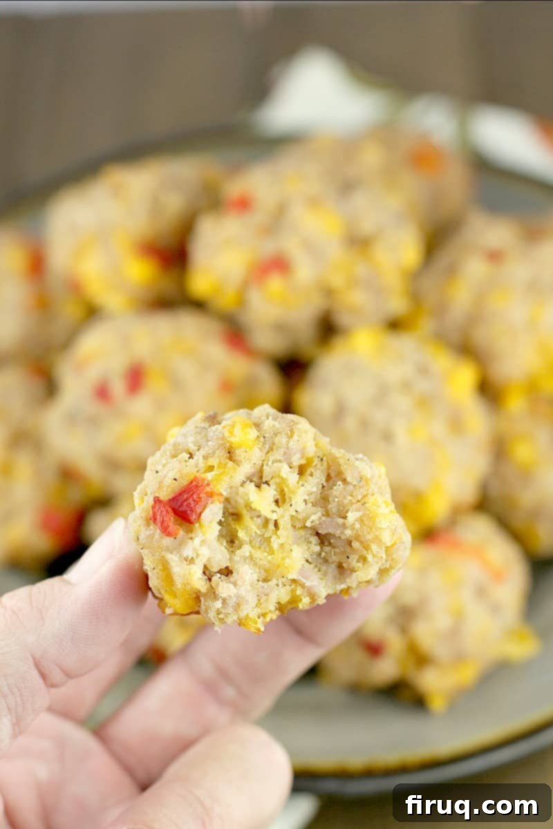Southern Pimento Cheese Sausage Bites 3 hand holding a sausage ball
