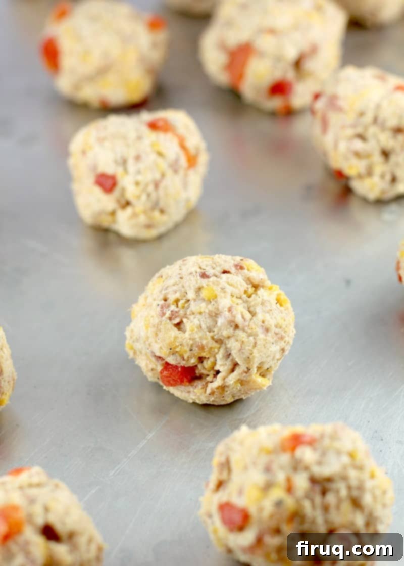 Southern Pimento Cheese Sausage Bites 5 prepared sausage balls on bake sheet, uncooked