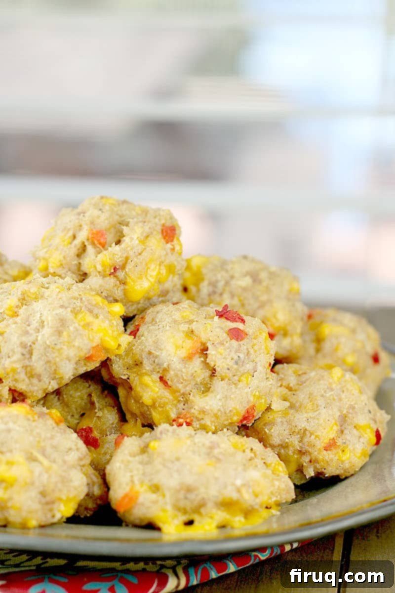 Southern Pimento Cheese Sausage Bites 8 sausage balls on a plate, side view