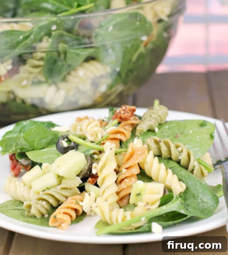 Vibrant Spinach Rotini Pasta Salad 3 close view of salad on white plate
