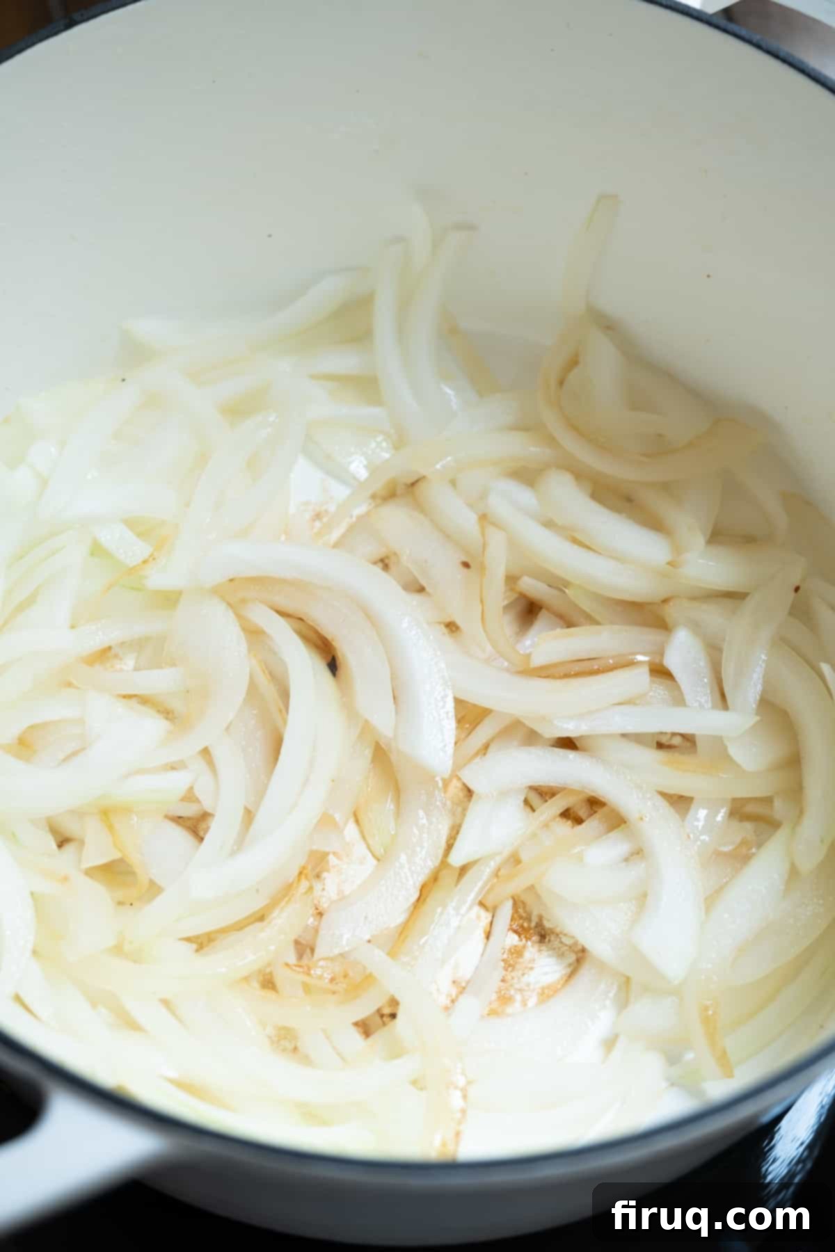 Hearty Italian Cabbage 6 Onions sautéing in olive oil, beginning to soften and caramelize