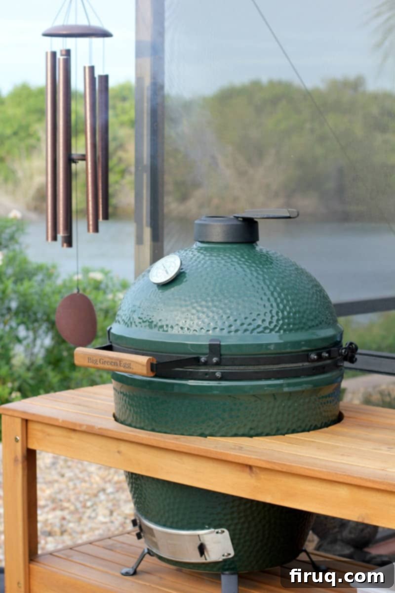 Grilled Green Bean Casserole with Crispy Bacon 3 A large Big Green Egg kamado grill set in an outdoor table, ready for delicious cooking.