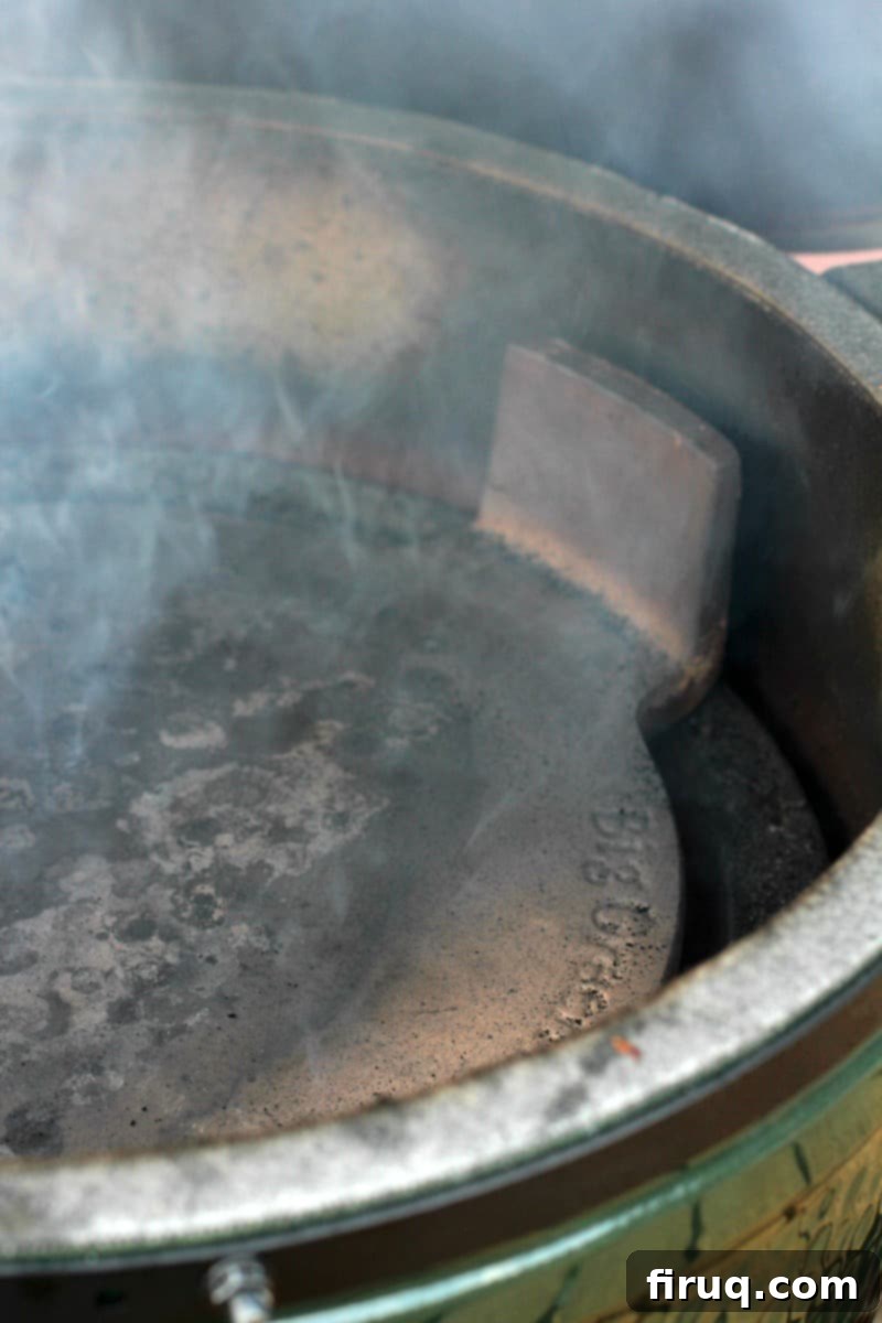 Grilled Green Bean Casserole with Crispy Bacon 4 Close-up inside a Big Green Egg showing the convEGGtor positioned with legs up for indirect cooking.
