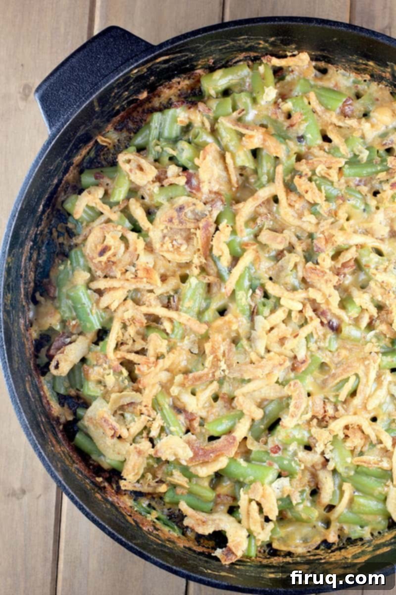 Grilled Green Bean Casserole with Crispy Bacon 9 Overhead view of a perfectly cooked grilled green bean casserole, showcasing the golden-brown crispy fried onions.