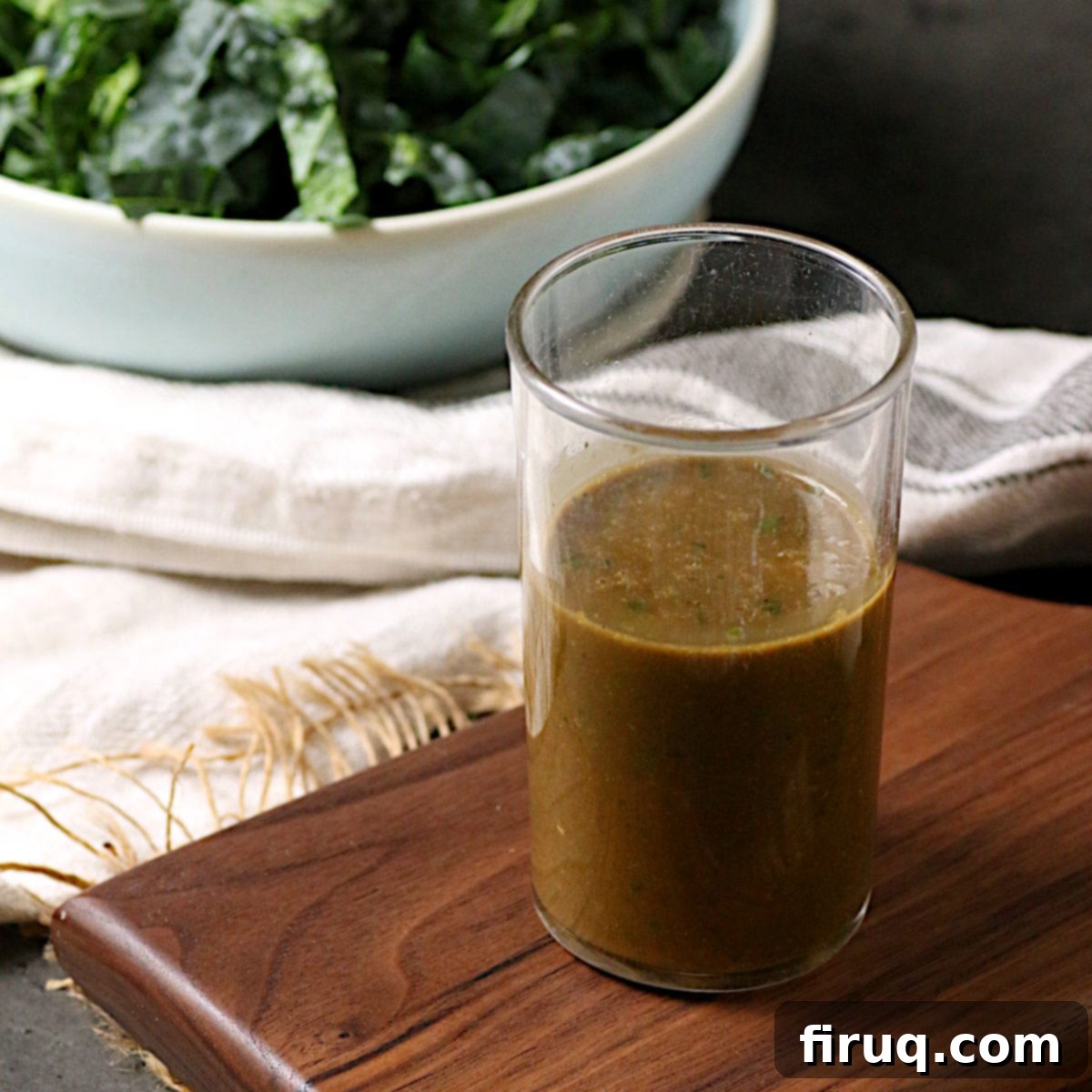 Basil Balsamic Vinaigrette Recipe Image A glass jar of Basil Balsamic Vinaigrette, seen from a high angle.