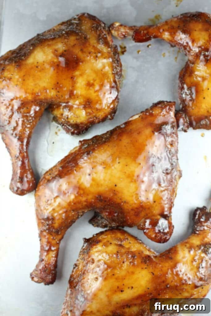 Grilled Beer-Infused Bacon Cheddar Joes 9 Smoked chicken quarters arranged on a baking sheet, glistening with glaze