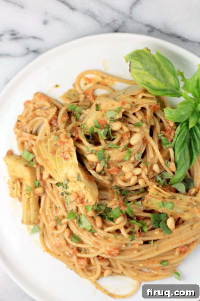 Rich Sun Dried Tomato Pesto Pasta 3 top down view of spaghetti on white plate