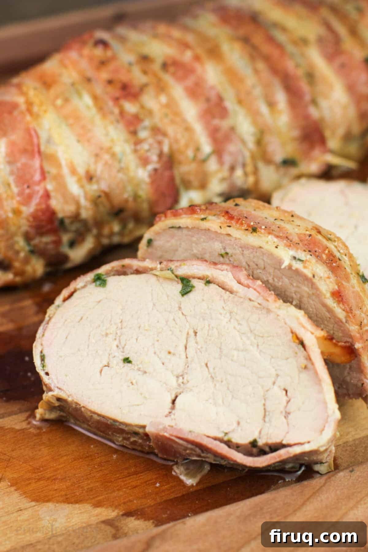 Easy Weeknight Roasted Pork Tenderloin 8 sliced pork on wood board