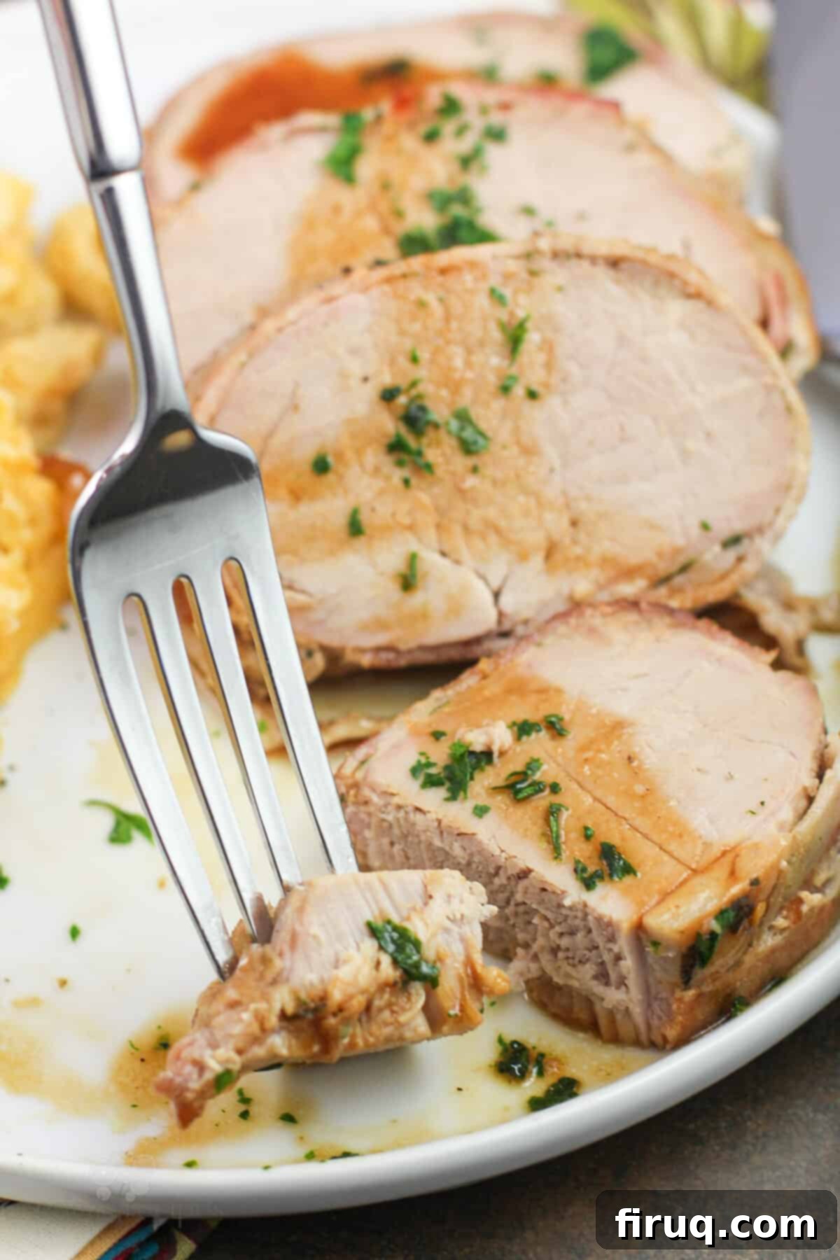 Easy Weeknight Roasted Pork Tenderloin 10 fork holding bite of pork