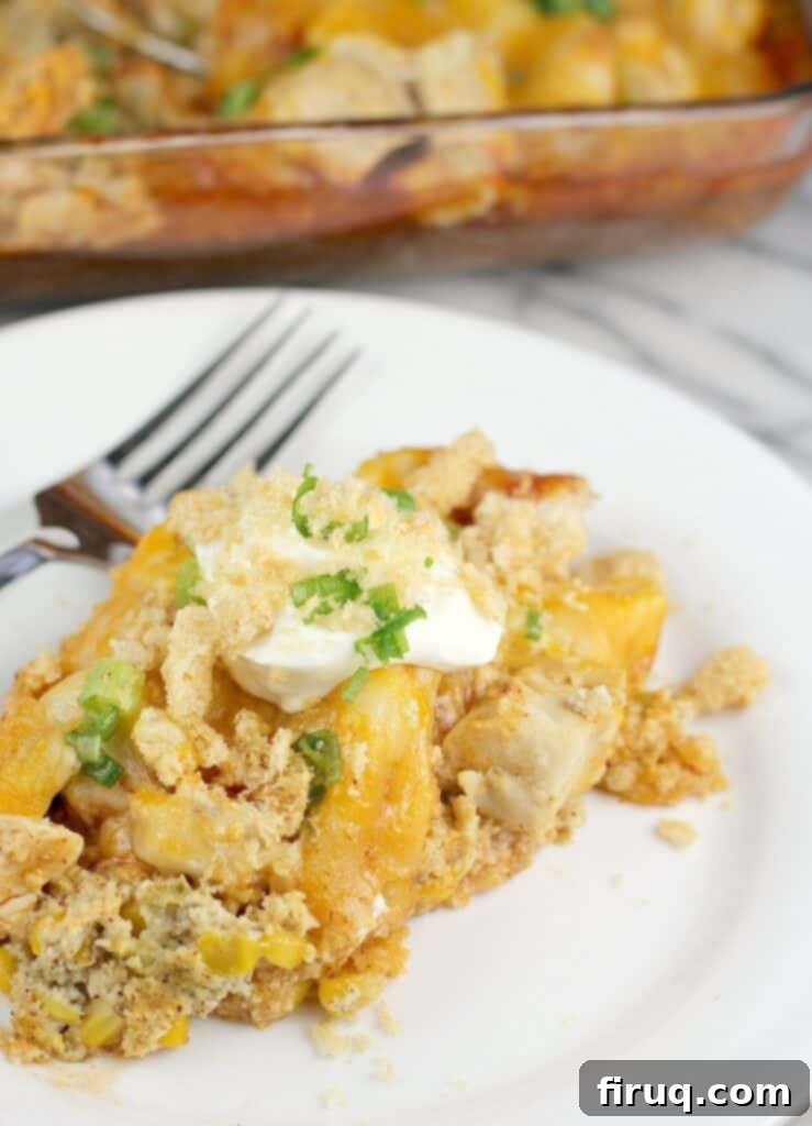 Instant Pot Chicken Carnitas 7 Finished Mexican chicken casserole plated on a white plate; bake dish is in the background