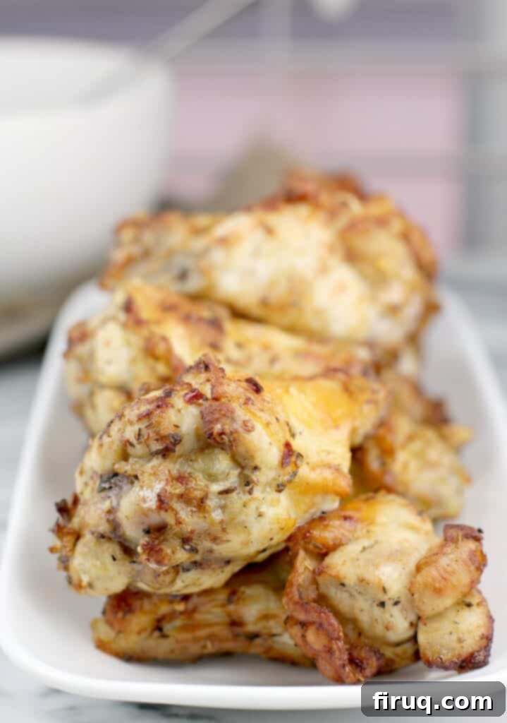 Instant Pot Chicken Carnitas 9 close-up of cooked air fryer chicken wings on a white dish