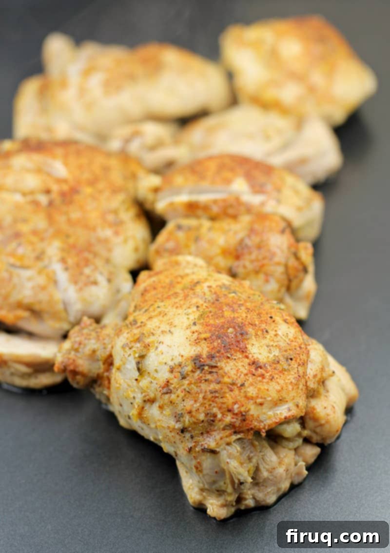 Instant Pot Chicken Carnitas 10 cooked whole chicken thighs on a bake sheet