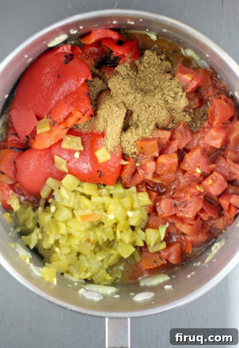 Sunrise Ranchero Kick 5 tomato, chiles, and red pepper in a saucepan
