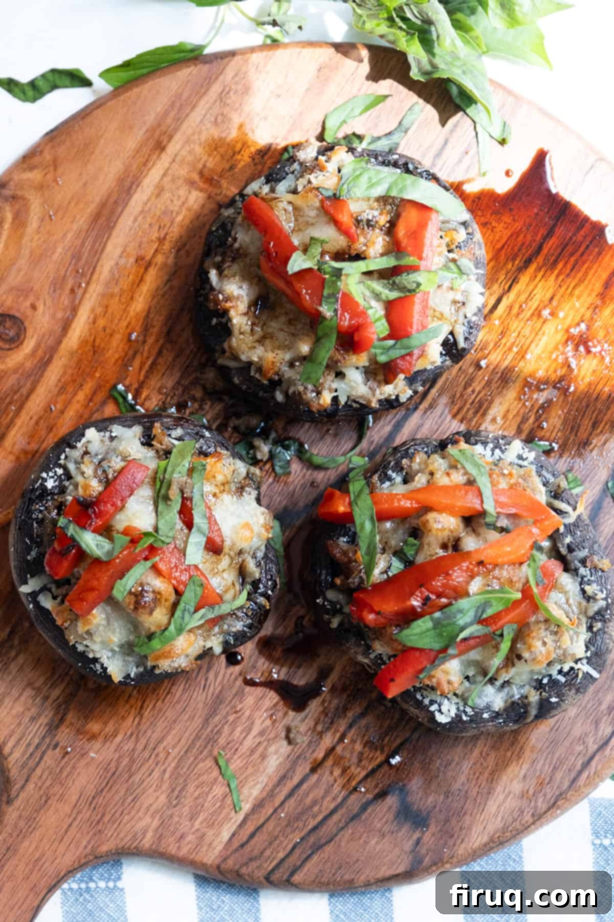 Gourmet Stuffed Italian Portobellos 11 finished product: mushrooms are baked and topped with red peppers, basil, and glaze.