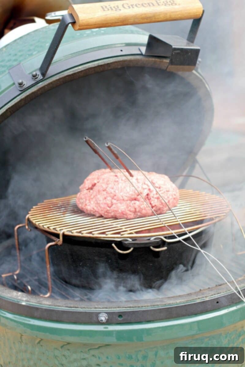 Ultimate Smoked Chili 6 loaf of raw ground beef on grill grate surrounded by smoke