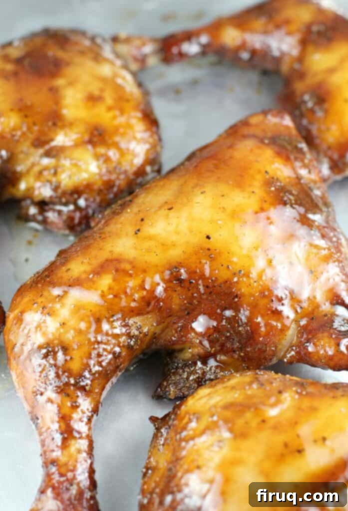 Ultimate Smoked Chili 8 glazed smoked chicken quarter on a bake sheet