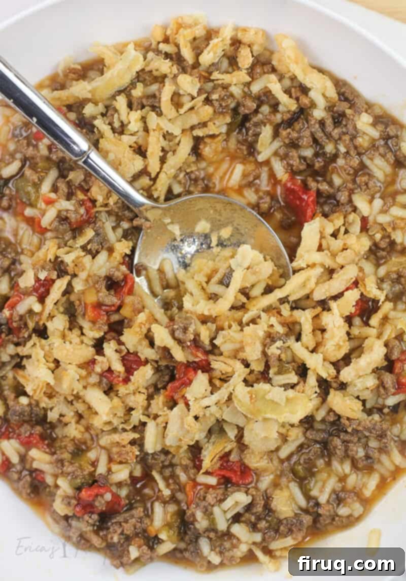 Adventure Sloppy Joes 11 white bowl with finished recipe and silber spoon