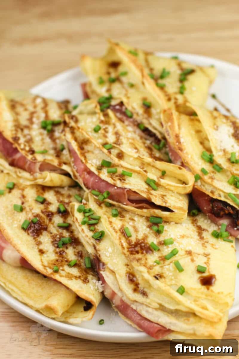 Prosciutto and Cheese Crepes 2 angled view of crespelle showing prosciutto inside