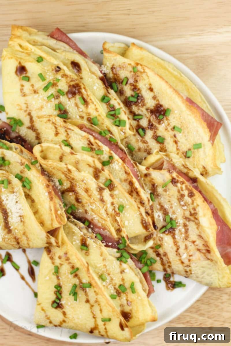 Prosciutto and Cheese Crepes 11 finished crespelle prosciutto e formaggio, top down view showing details of garnish