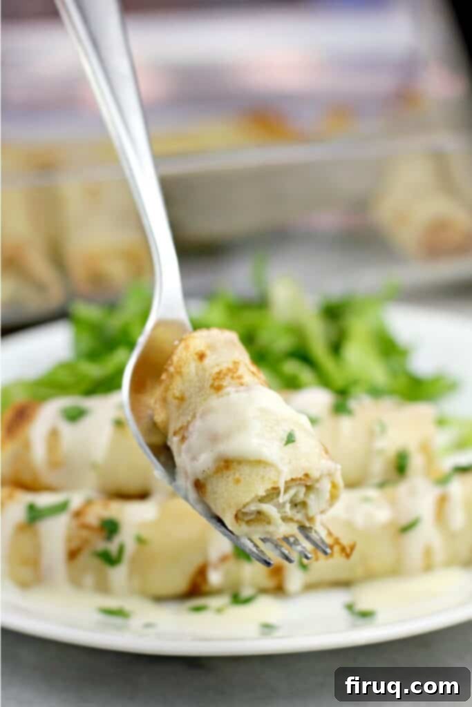 Prosciutto and Cheese Crepes 8 bite of crab crepe on a fork