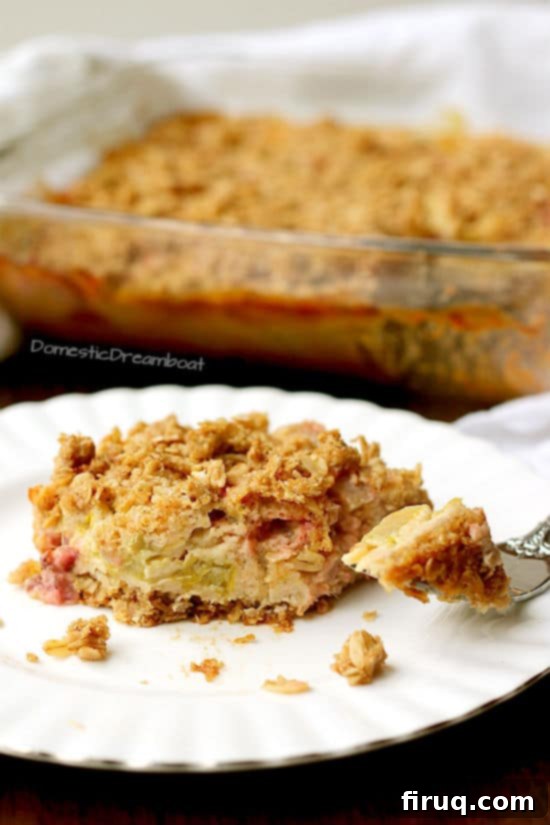 Old Fashioned Rhubarb Crisp Slice of rhubarb crisp on a white plate