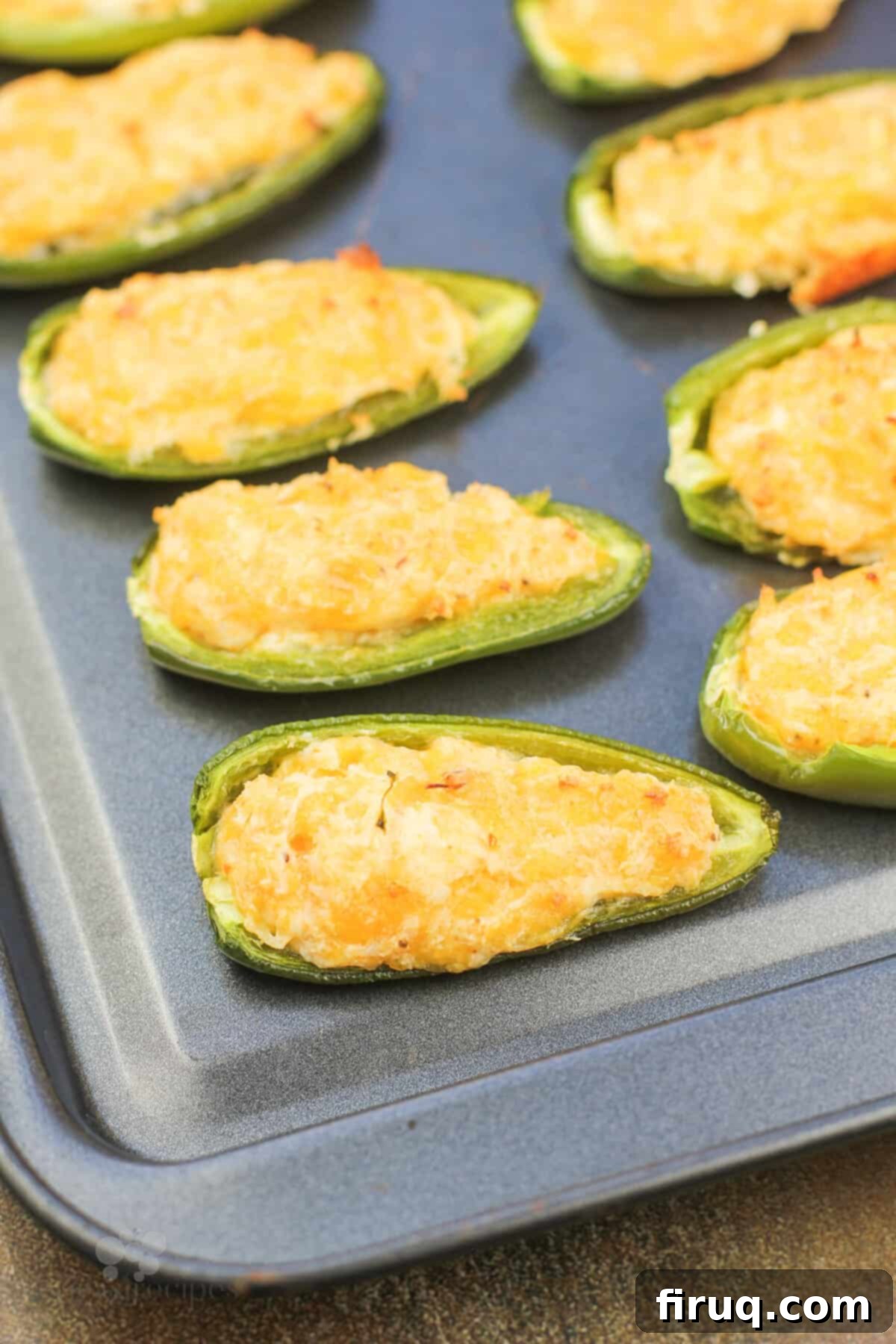 Spicy Shrimp Jalapeño Poppers 7 cooked shrimp jalapeno poppers on bake sheet