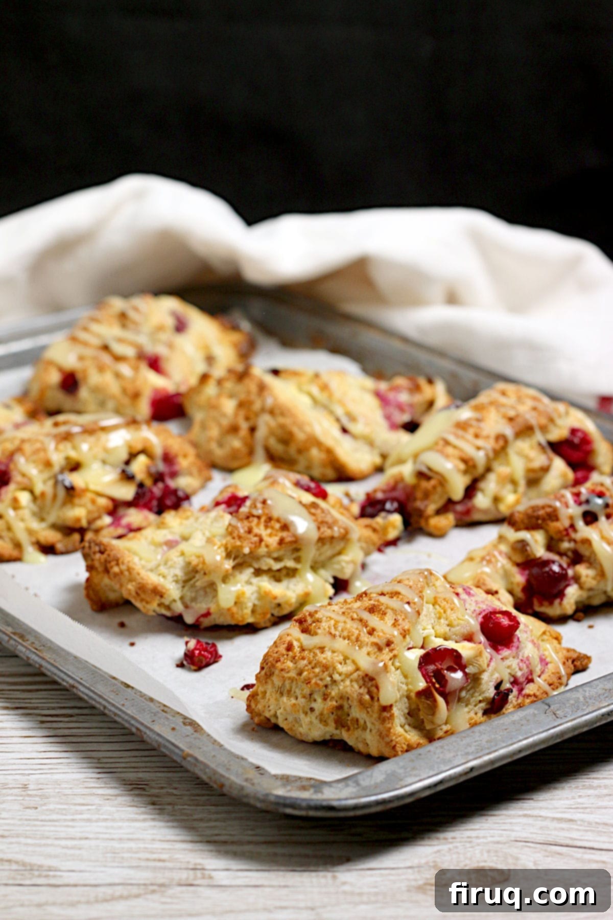 Freshly Baked Cranberry Orange Scones with White Chocolate Cranberry Orange Scones with White Chocolate on a baking sheet, golden brown and perfectly baked.