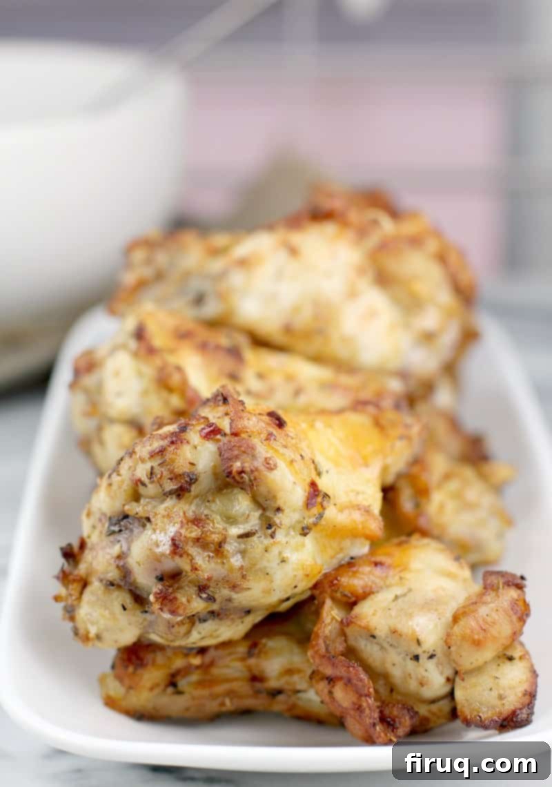 Crispy Greek Air Fryer Wings 2 close-up of cooked Greek-style air fryer chicken wings on a white dish
