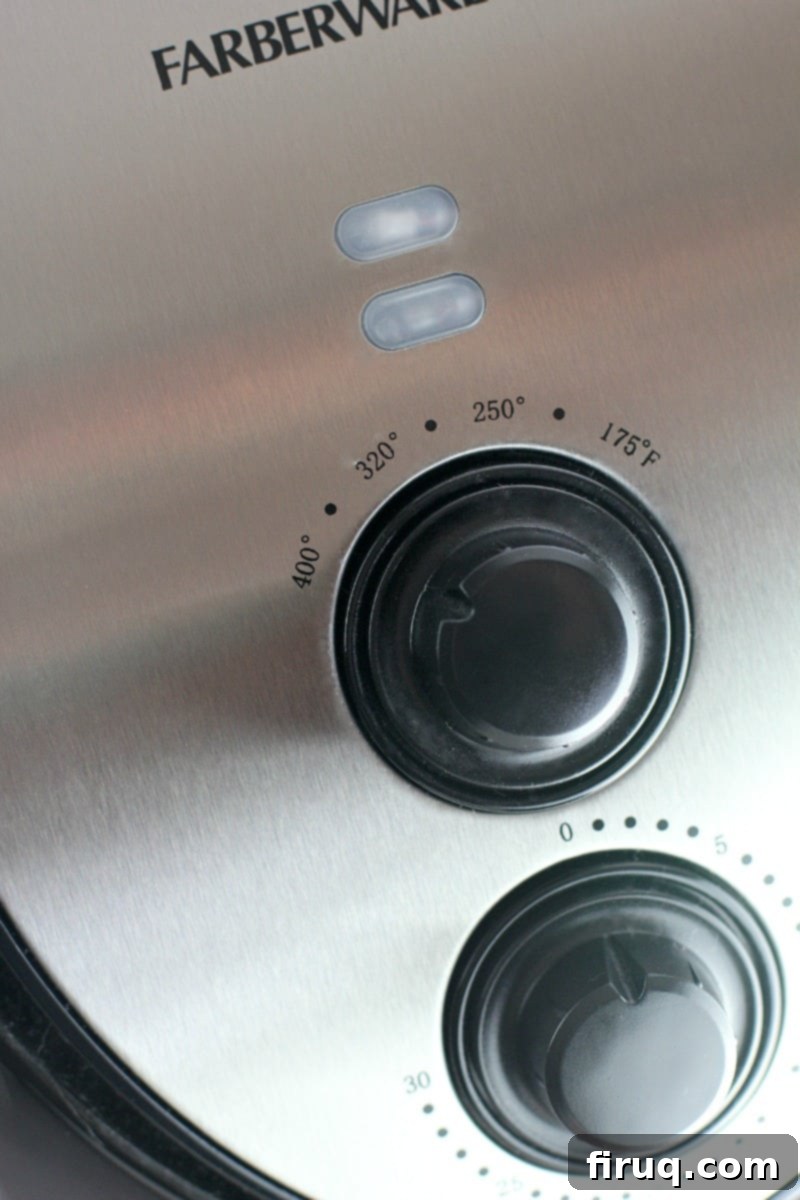 Crispy Greek Air Fryer Wings 5 view of the control dials of an air fryer preparing chicken wings