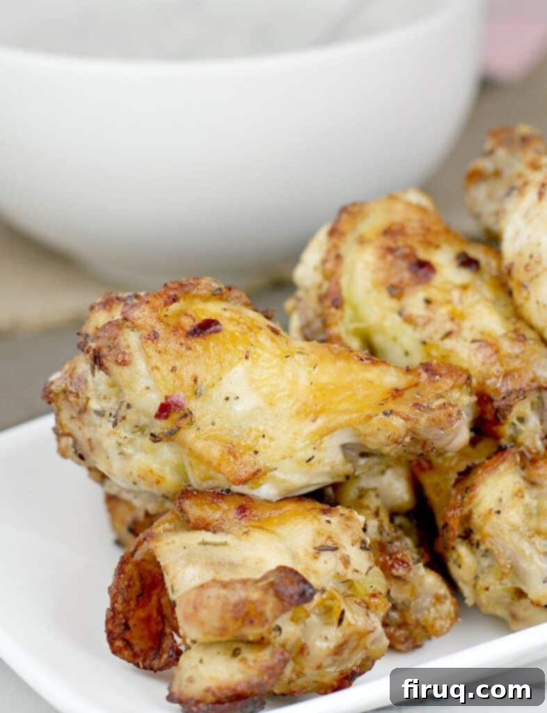 Crispy Greek Air Fryer Wings 7 stack of crispy Greek-style air fryer drumettes on a white dish