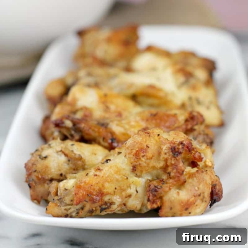Crispy Greek Air Fryer Wings 10 cooked air fryer Greek-style chicken wings on a white plate