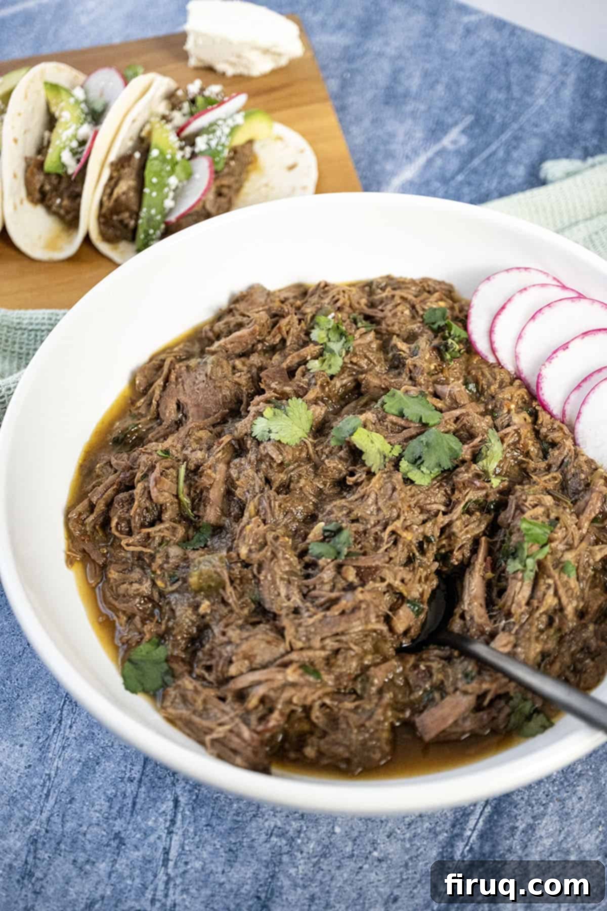Ultimate Dutch Oven Barbacoa Tacos 2 Barbacoa in a bowl topped with cilantro