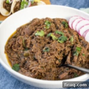 Ultimate Dutch Oven Barbacoa Tacos 10 Barbacoa in a bowl topped with cilantro.